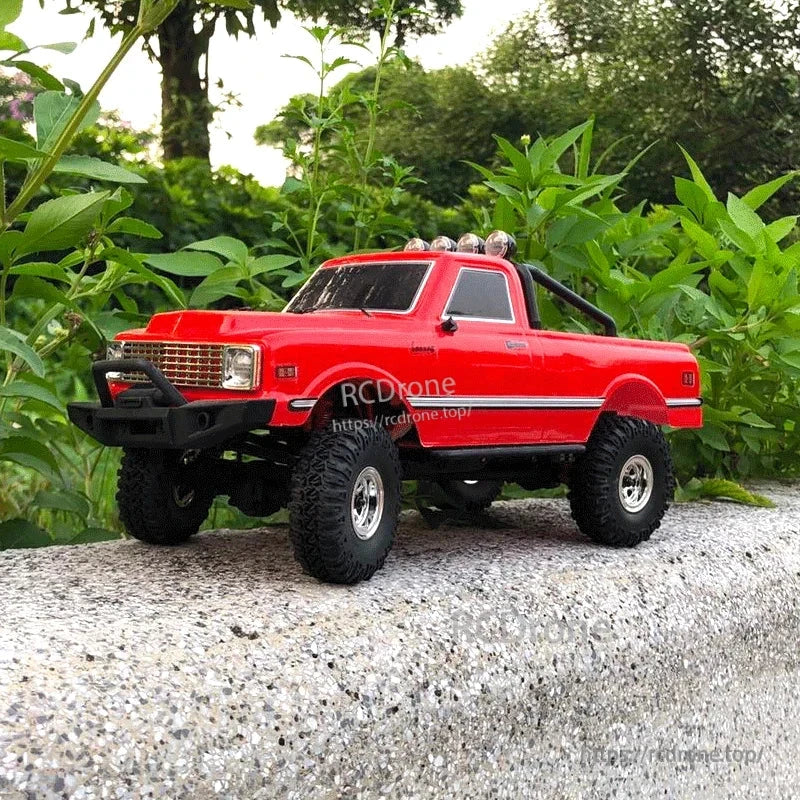 D1RC 1/18 2.4G Mini Off‑Road Rock Crawler RC Car, Red 1/18 scale 4WD off-road RC truck featuring waterproof ESC, LiPo battery, and durable ladder frame for rugged terrain performance.