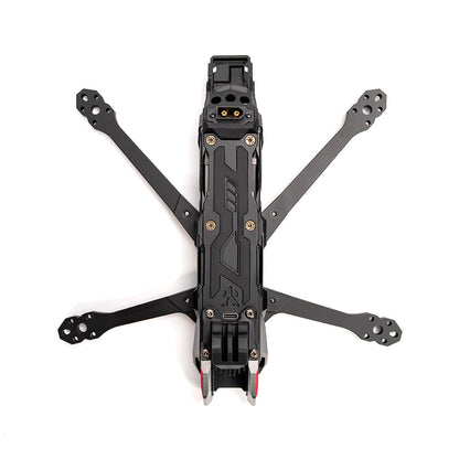 Top-down view of assembled FPV drone frame showing four arms, center plate, and front camera mount area
