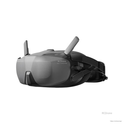 DJI Goggle, DJI FPV goggle headset with dual antennas and adjustable head strap, side view in black and gray