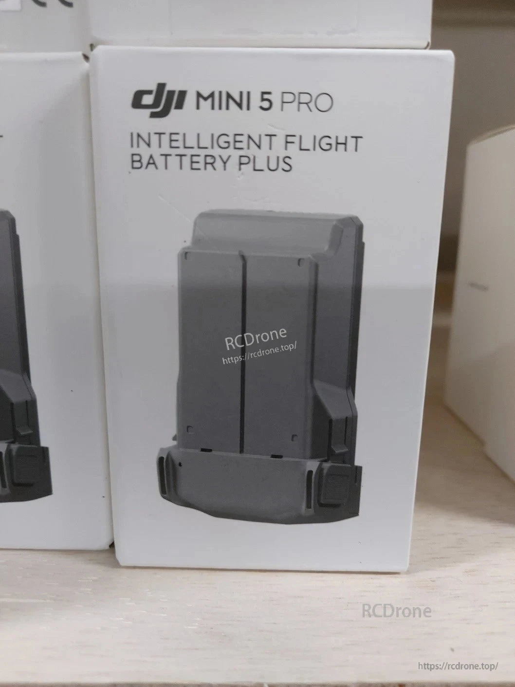DJI Mini 5 Pro Intelligent Flight Battery Plus retail box with printed battery image on front