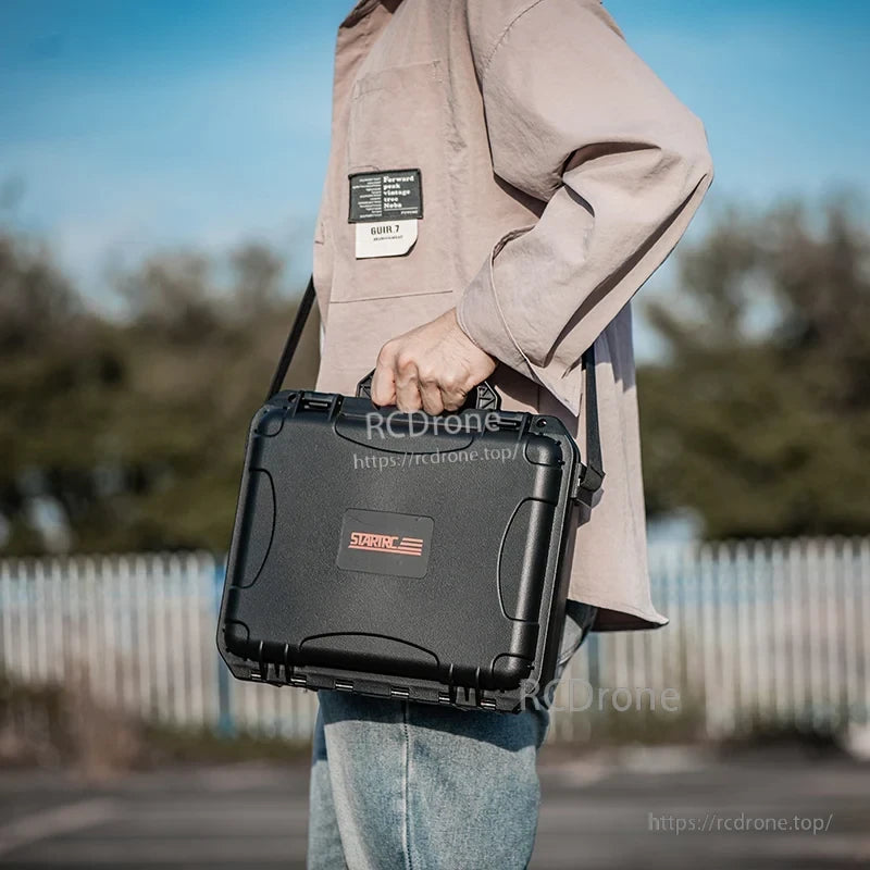 DJI Osmo Action 5 Pro Hard Case, The upper tray organizes core camera gear and the lower layer has deep compartments for larger accessories.