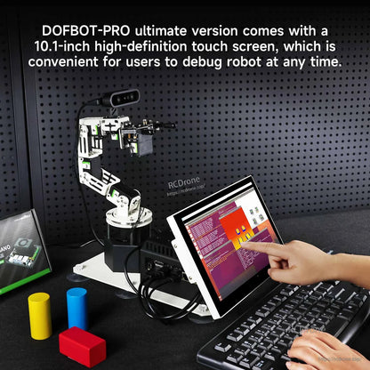 10.1-inch touchscreen debugging setup controlling the robotic arm, with hand tapping screen beside keyboard