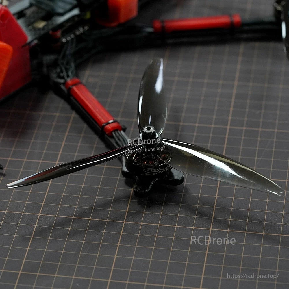 Close-up of a Dalprop Cyclone T7057 two-blade drone propeller mounted on a quadcopter motor