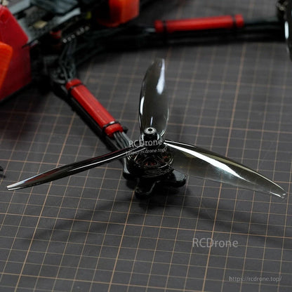 Close-up of a Dalprop Cyclone T7057 two-blade drone propeller mounted on a quadcopter motor