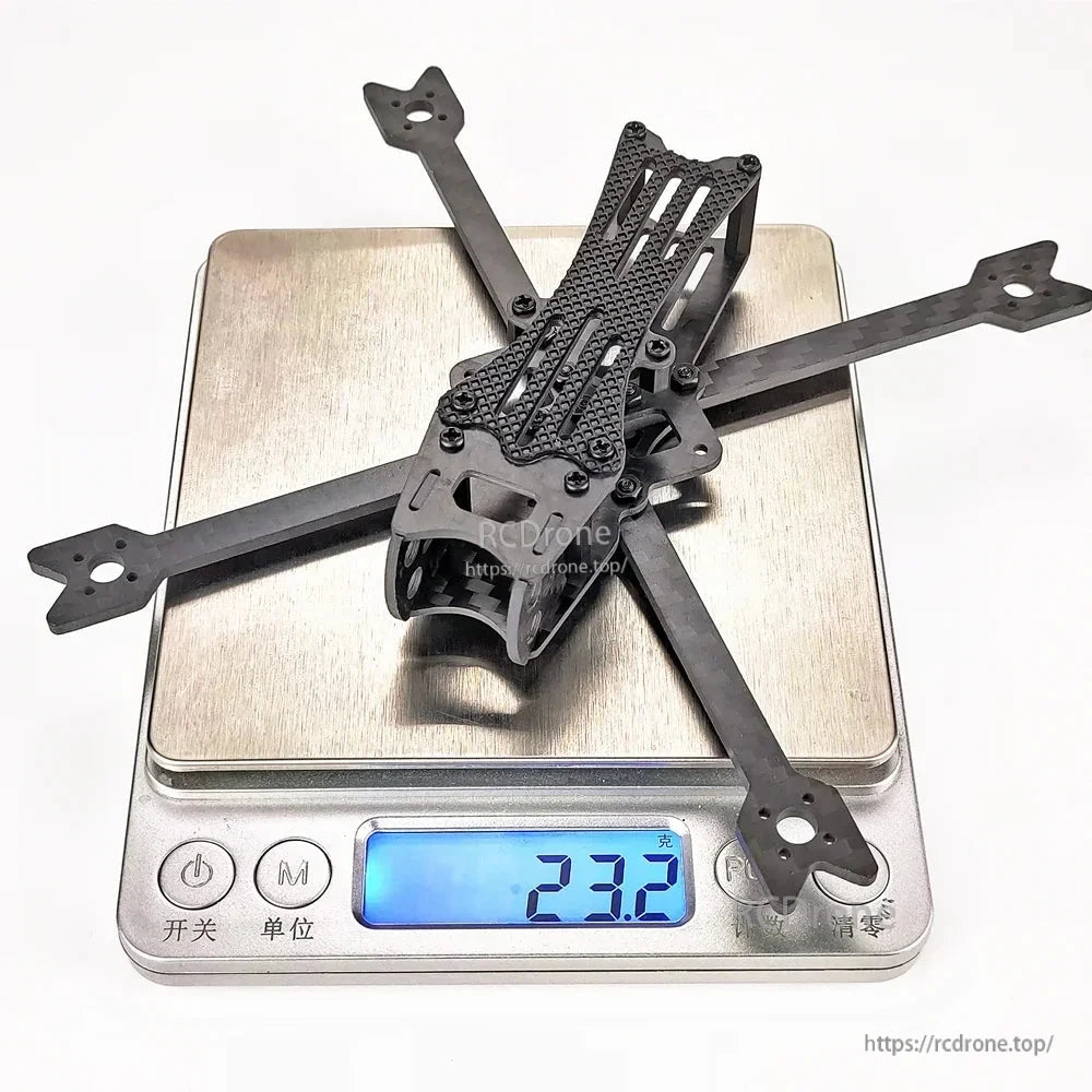 Darwin BabyApe 3 Inch Toothpick FPV Frame on digital scale showing 23.2g weight