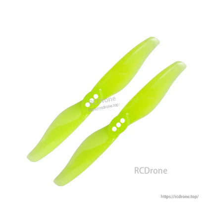 Neon green 2-blade propeller pair with three-hole mounting pattern, angled top view