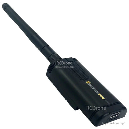 Angled side view of TX module showing textured housing and antenna mounting collar