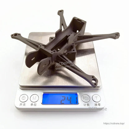 FPV frame shown on digital scale with 24.1 g weight reading