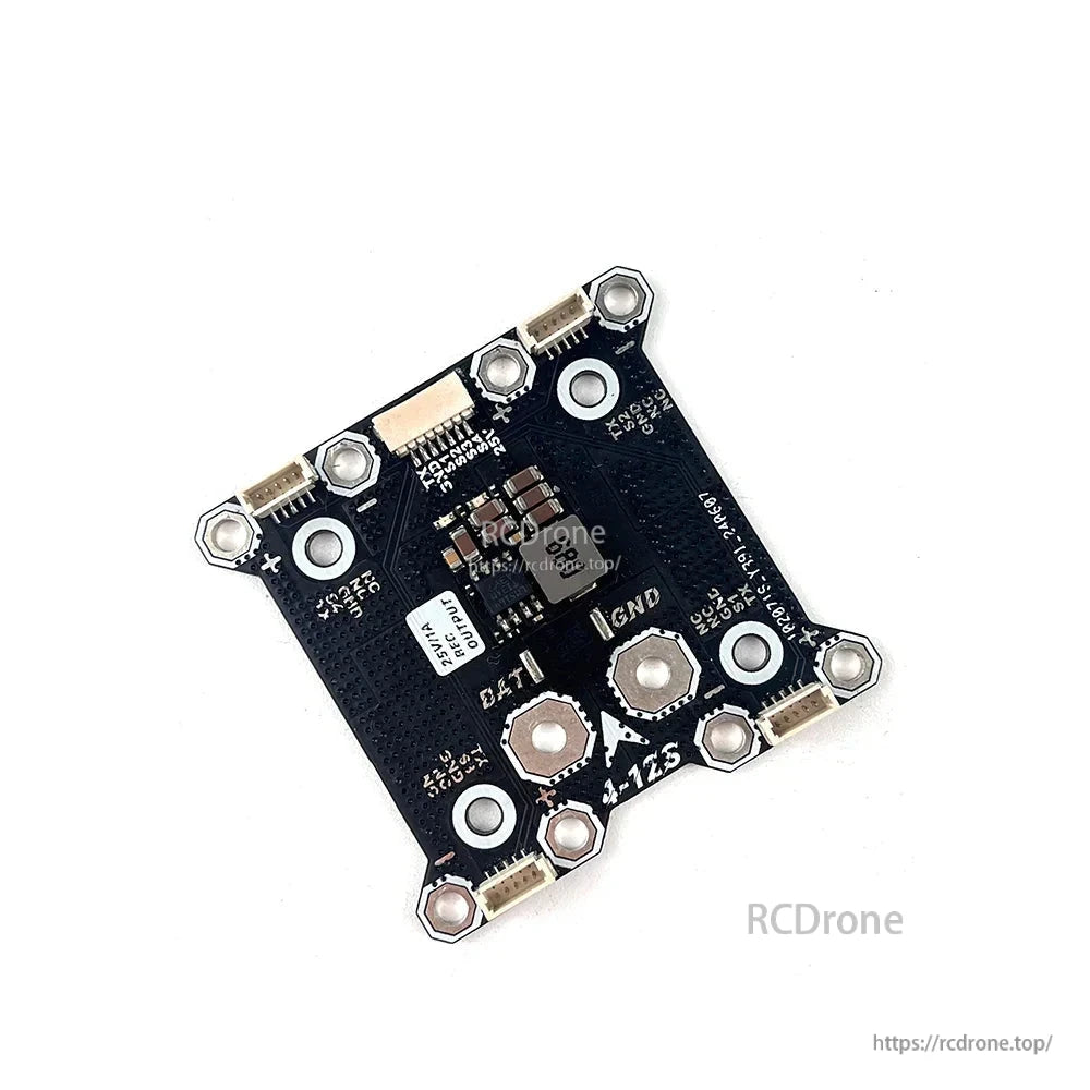 Angled view of DarwinFPV 25V BEC PDB showing regulator components, JST connectors, and mounting holes