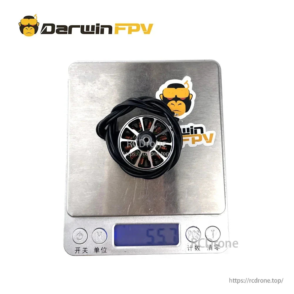Brushless motor on digital scale showing weight reading of 55.7 g
