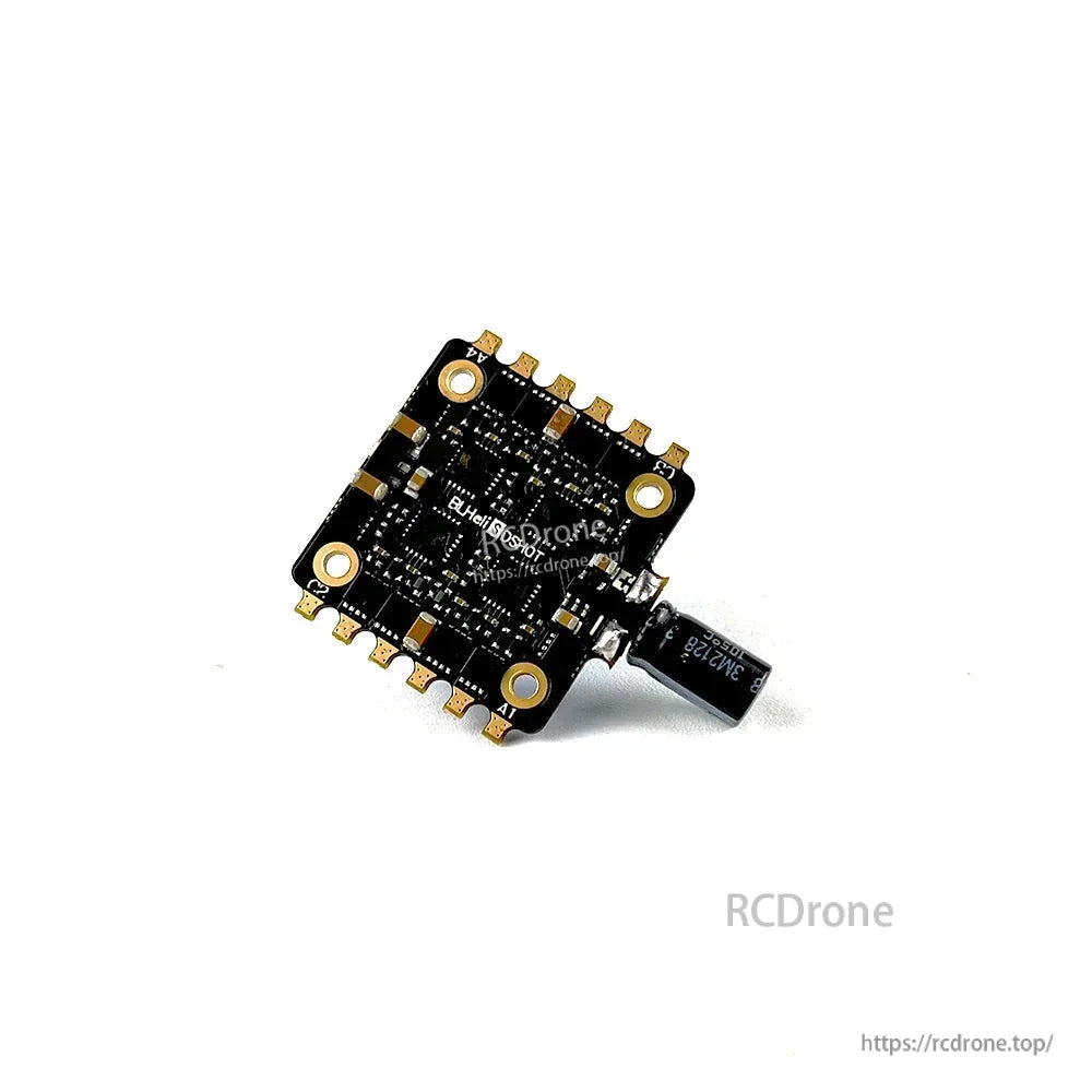Close underside view showing 30.5x30.5 mounting pattern, solder pads around edges, and attached capacitor