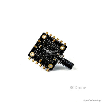 Close underside view showing 30.5x30.5 mounting pattern, solder pads around edges, and attached capacitor