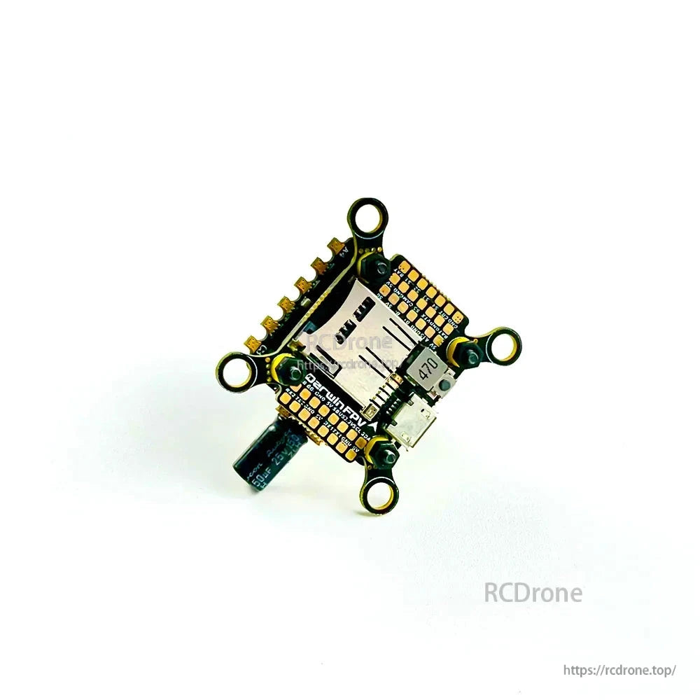 Rotated top view highlighting four mounting holes, SD card slot placement, and edge solder pads
