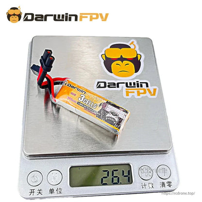 DarwinFPV 3S 380mAh LiPo battery on digital scale showing approx. 26.4g weight