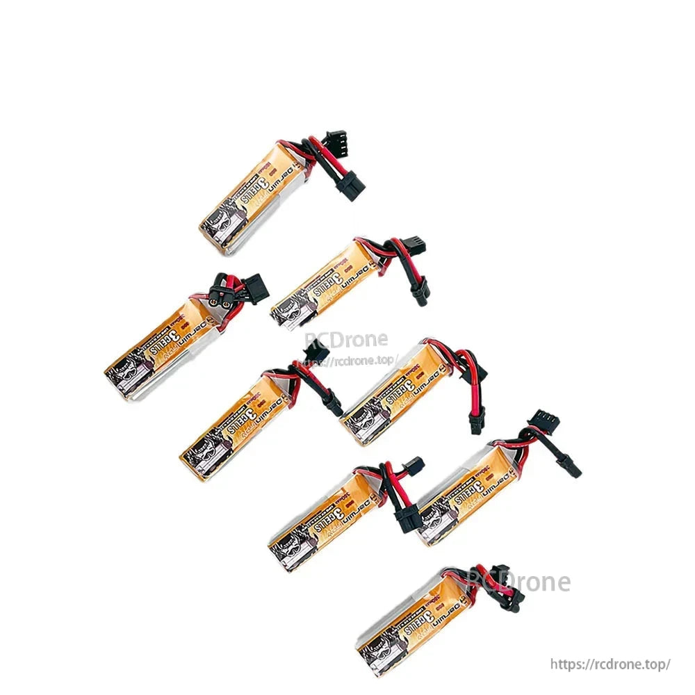 Seven DarwinFPV 3S LiPo batteries laid out in a set, showing labels and attached power leads