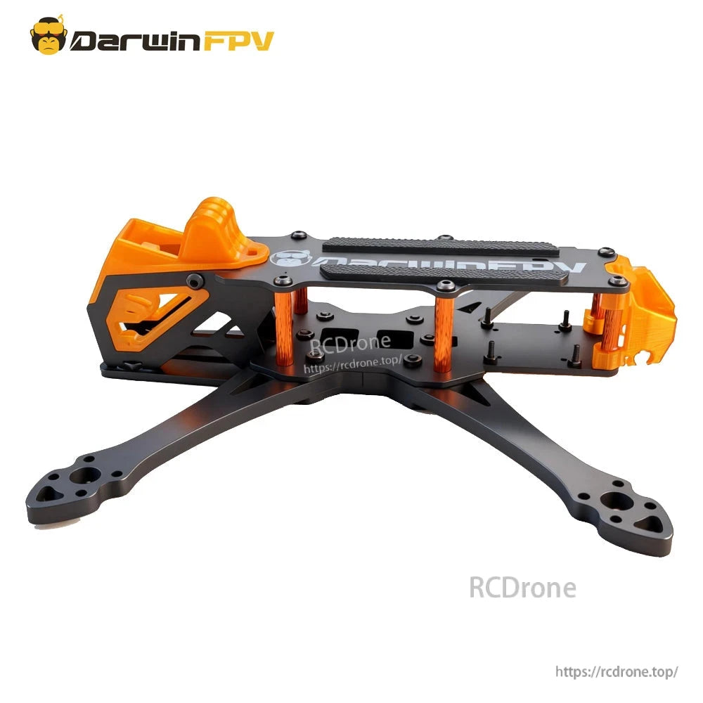 Side profile of frame showing orange side panels, standoffs, and extended carbon fiber arms