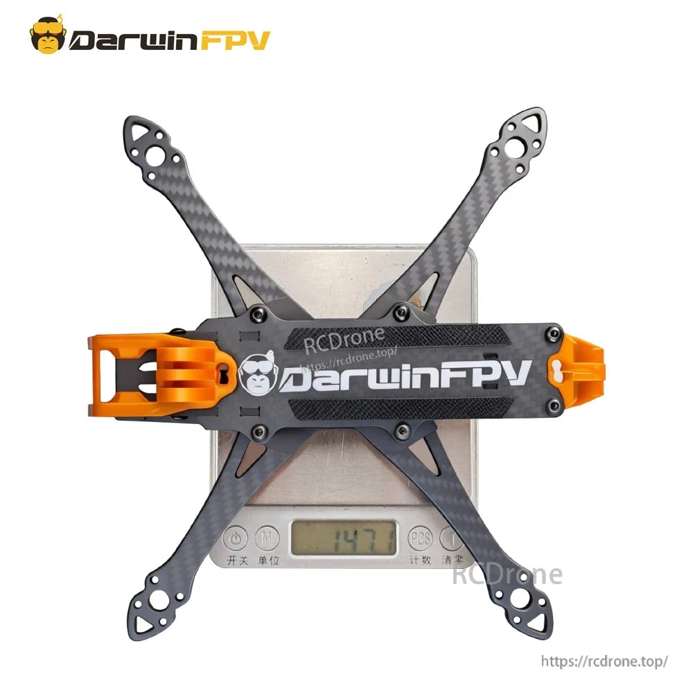 Frame on digital scale showing 147.7 g weight reading, top plate with DarwinFPV logo