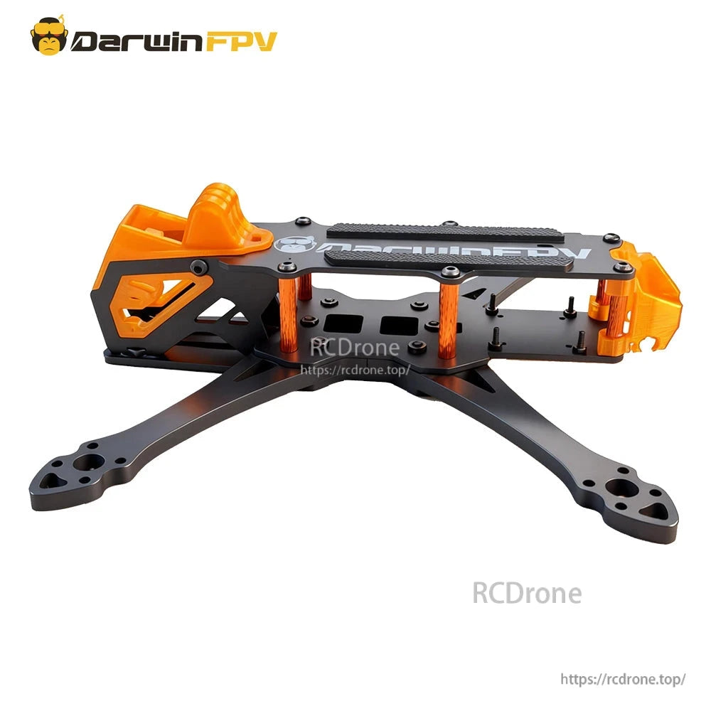 Side profile of assembled carbon FPV frame showing stacked plates and orange aluminum standoffs