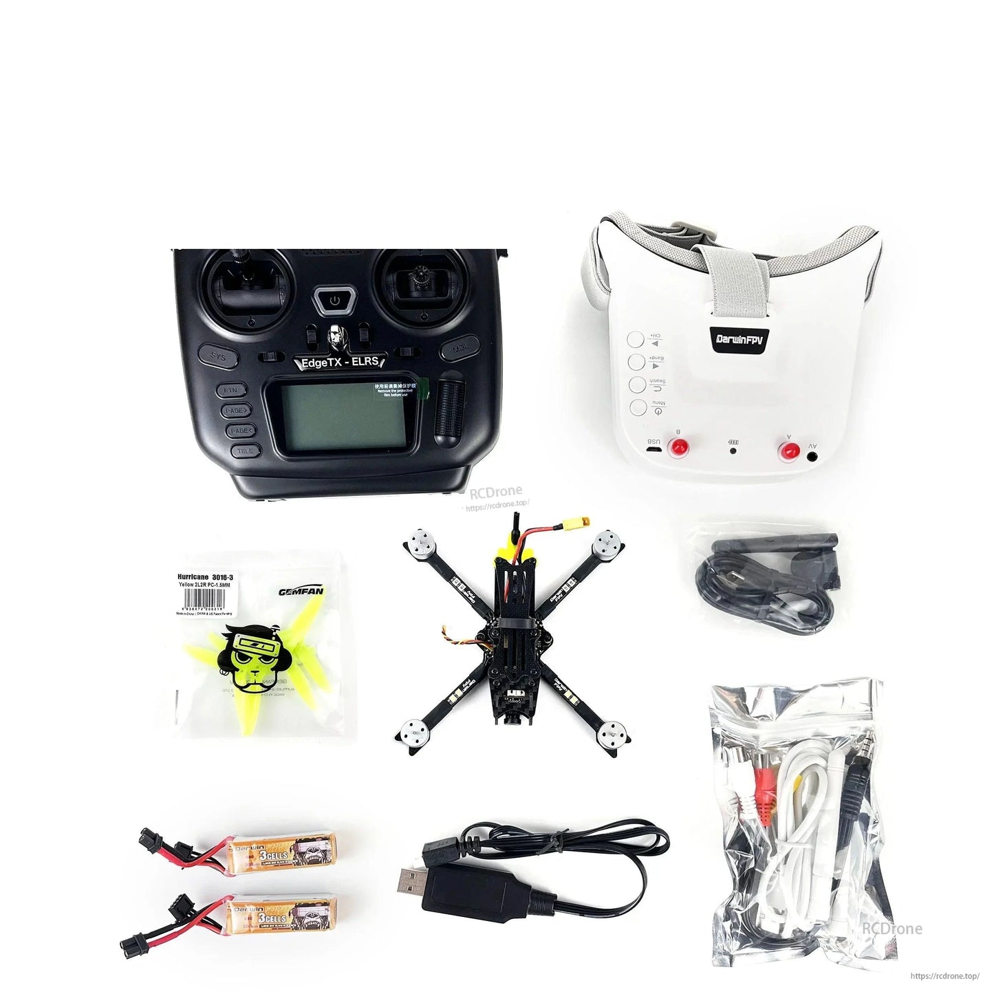 DarwinFPV kit bundle layout showing controller, goggles, mini quadcopter, battery pair, charger lead and accessory cables