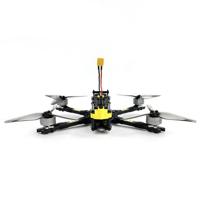FPV quadcopter front view showing camera mount, battery lead and low-profile frame layout