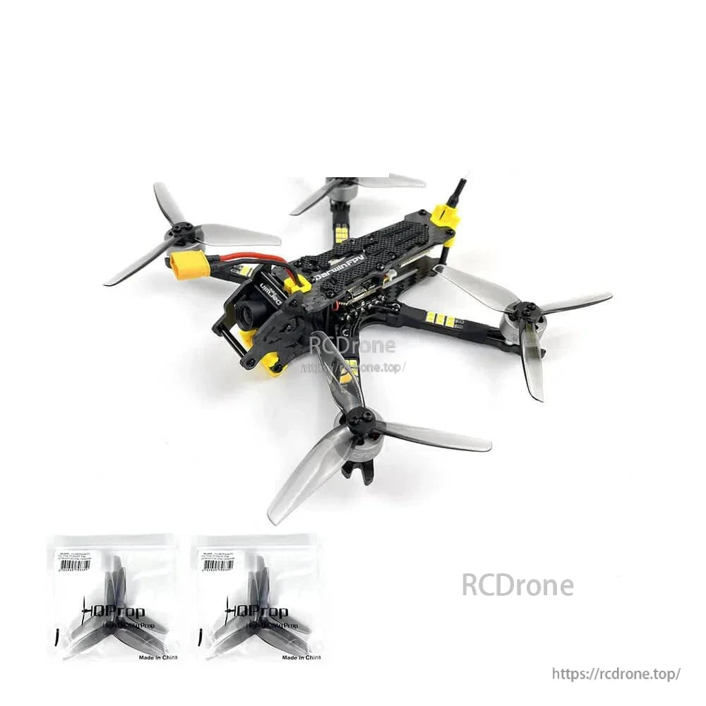 Drone with two spare propeller sets included, displayed below the quadcopter