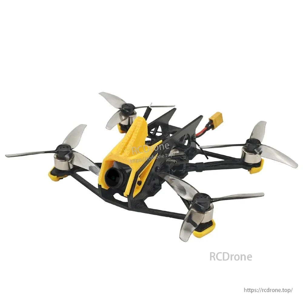 Front-left close angle of FPV quadcopter showing yellow camera canopy, frame braces, and propellers