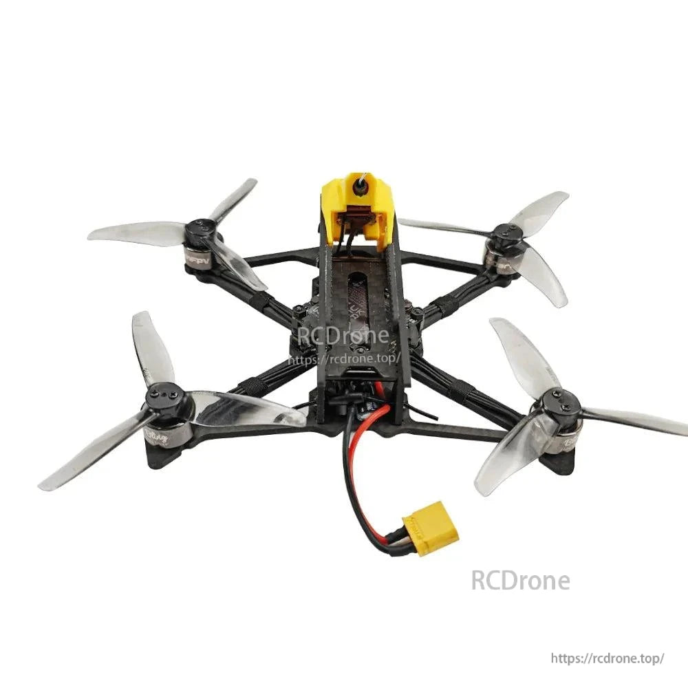 Rear view of FPV quadcopter showing battery power lead and connector, carbon frame, and rear motors