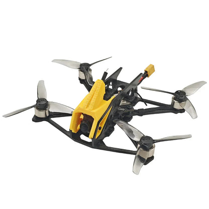 Front-right angle view of FPV quadcopter with yellow camera housing and carbon fiber arms