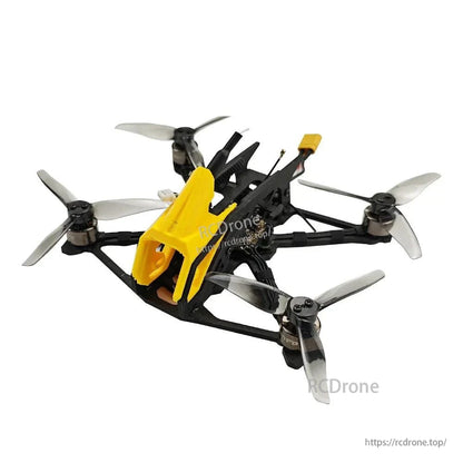 Rear-left angle view of carbon frame FPV quadcopter showing stacked plates and motor positions