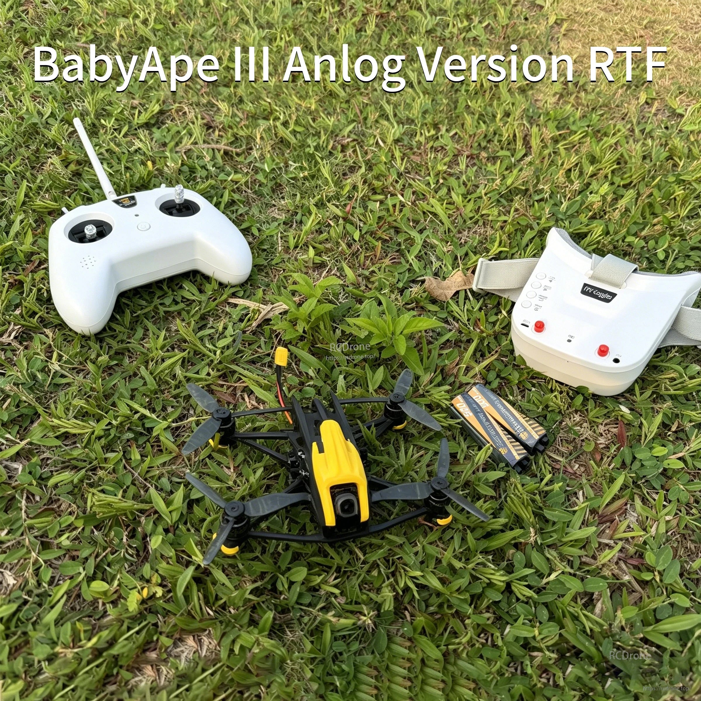 DarwinFPV BabyApe III Analog Version RTF kit on grass with TX8 transmitter, EV800DM goggles and batteries
