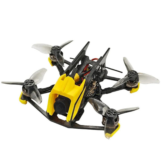 DarwinFPV micro FPV quadcopter with yellow camera canopy, 4 props, front-left angle on white