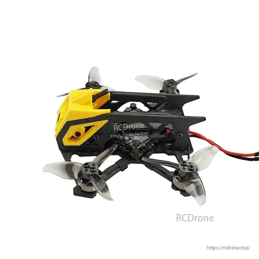 Right-side view of quadcopter with yellow canopy and visible electronics stack through frame cutouts