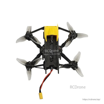 Top-down view of micro quadcopter showing canopy, prop layout, and battery lead exiting rear
