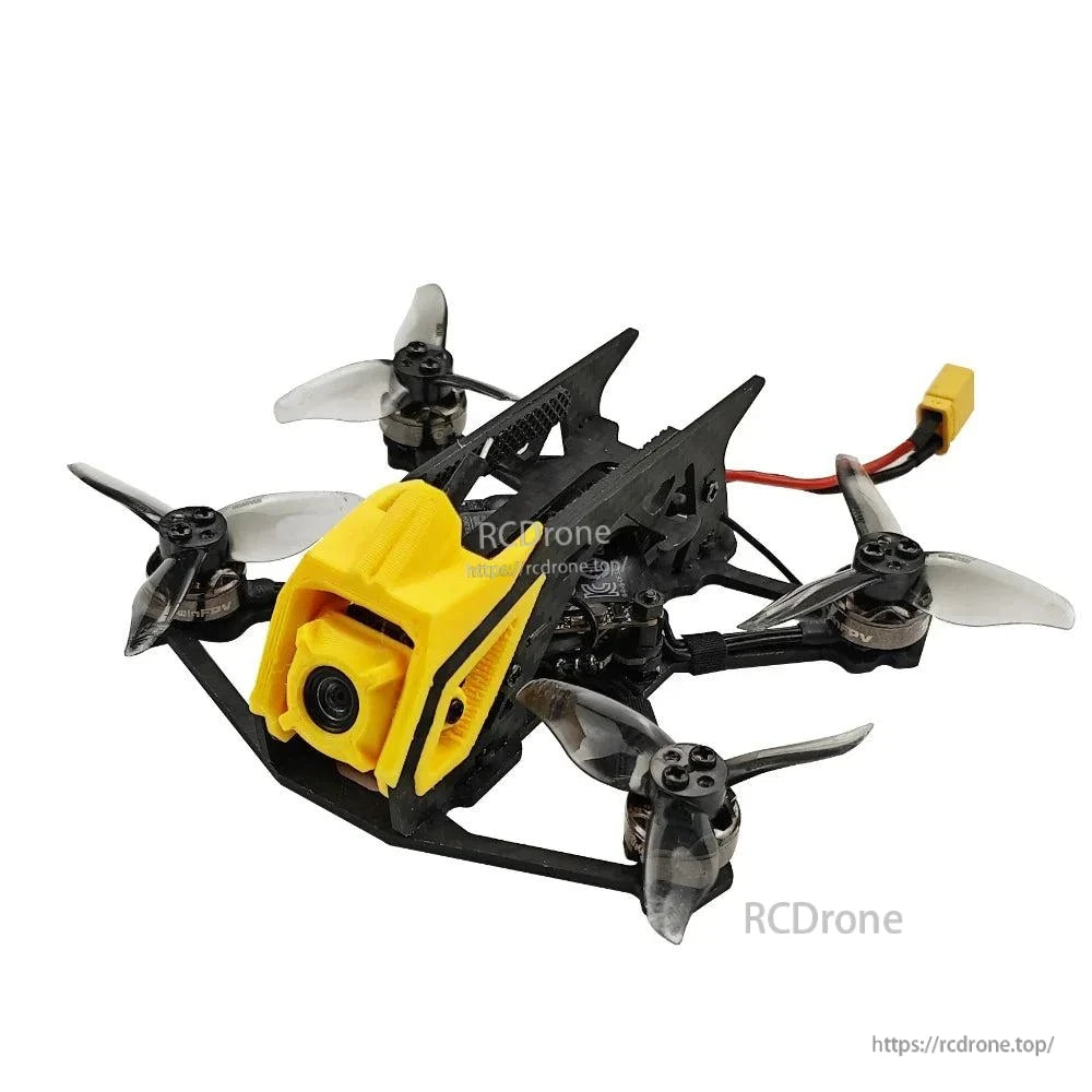 Front-left view with XT30 lead visible, showing camera lens and rear frame fins