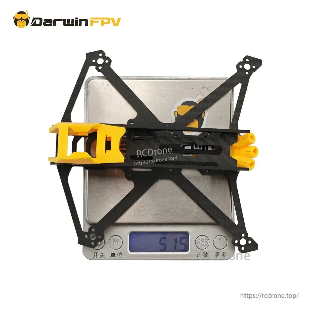 Frame on digital scale showing 51.5 g weight reading