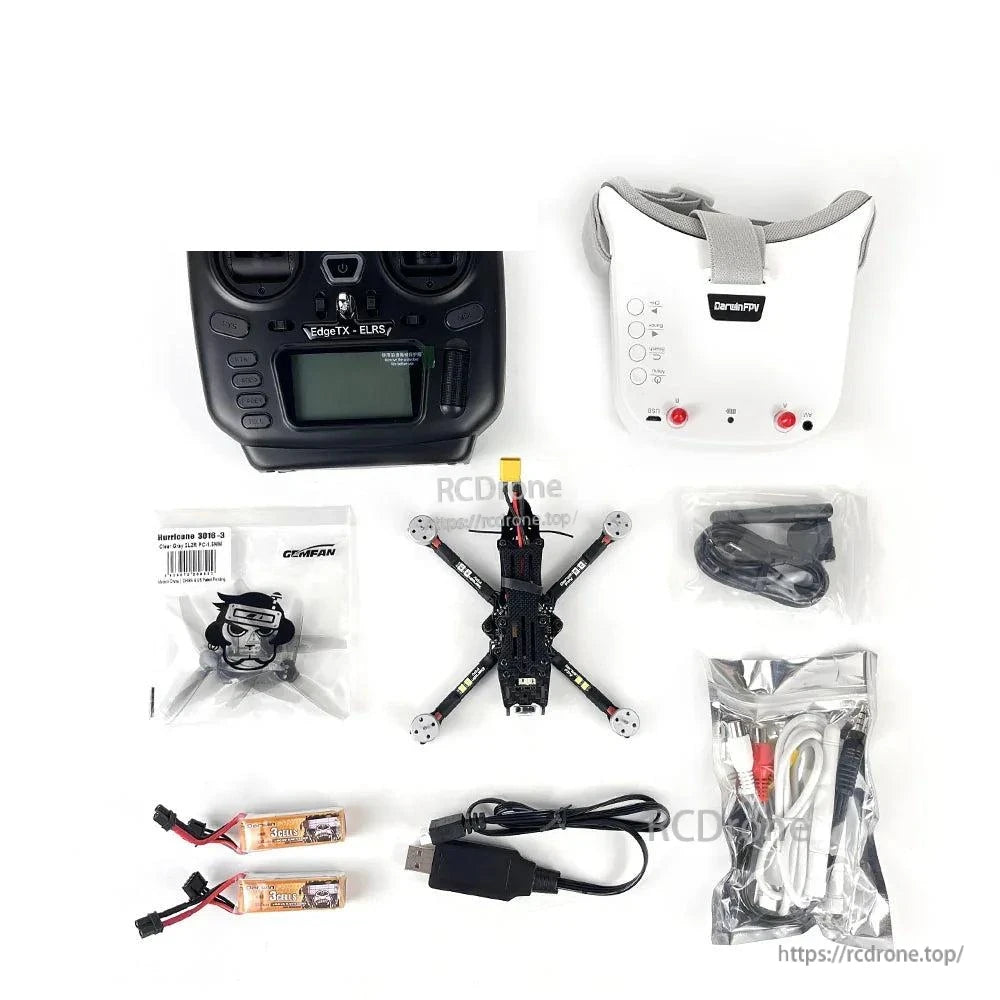 FPV drone kit layout with radio transmitter, FPV goggles, quadcopter, batteries, USB cable, and accessories