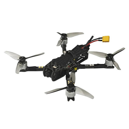 Rear three-quarter view of FPV quadcopter with grey props, motor layout, and top-mounted strap