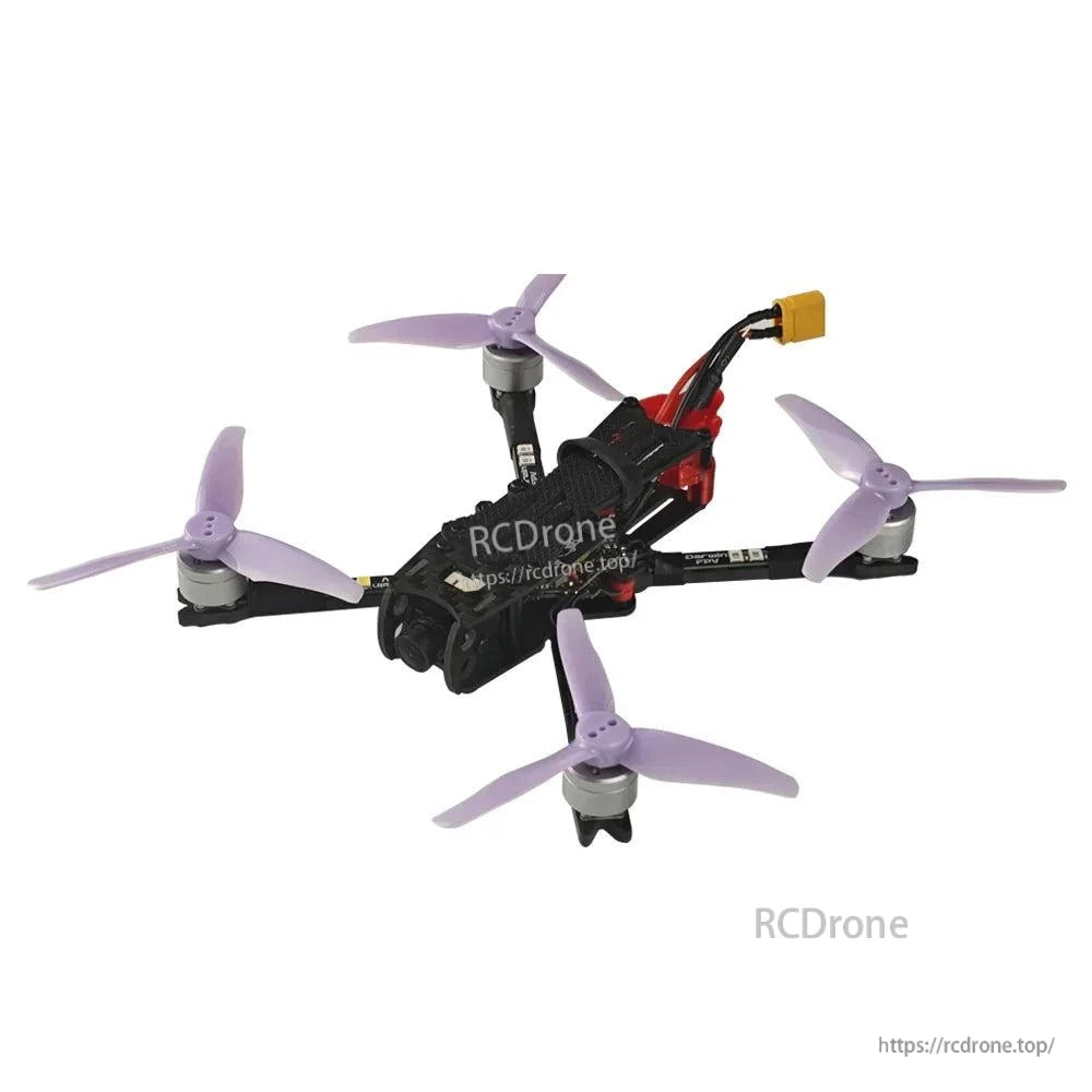Side angle FPV quadcopter with purple propellers, rear wiring, and yellow battery connector lead