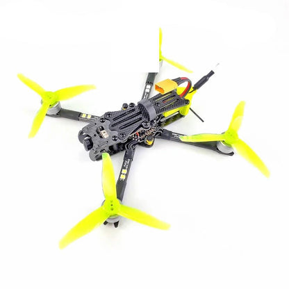DarwinFPV quadcopter angled top view with neon yellow tri-blade propellers and carbon frame