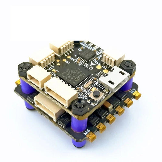 DarwinFPV Betaflight F4 flight controller stack with USB port, JST connectors, and soft mounting grommets