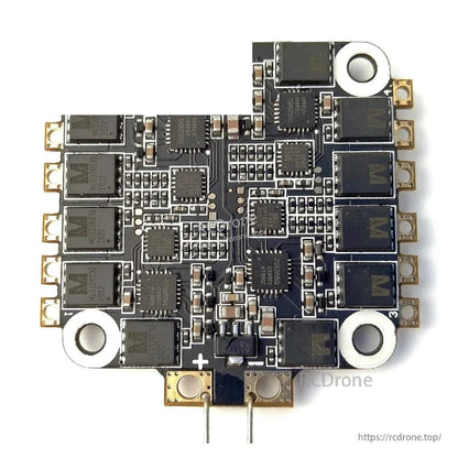 Component-side view of 4-in-1 ESC board with MOSFETs, driver chips, and power leads