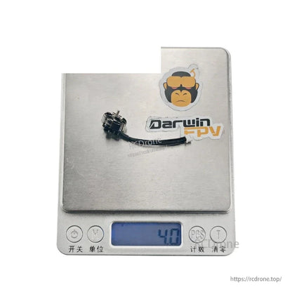 Motor shown on digital scale reading 4.0 g, DarwinFPV logo background
