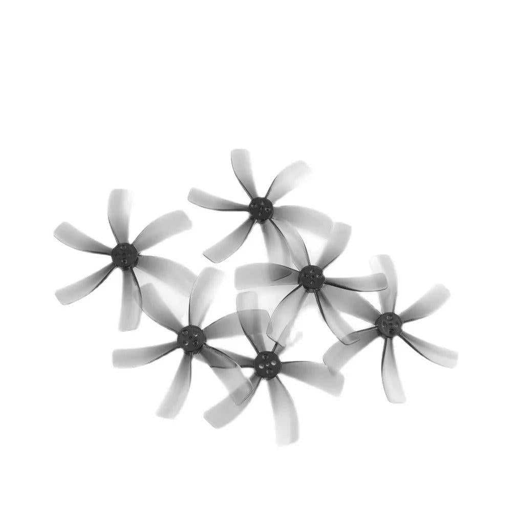 Set of four 63mm 6-blade FPV drone propellers laid out on white background