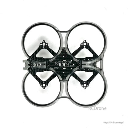Underside view of the frame showing four duct rings and carbon fiber plate mounting holes