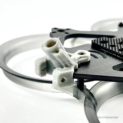 Close-up of rear 3D-printed mount bracket attached to the carbon plate and duct guard