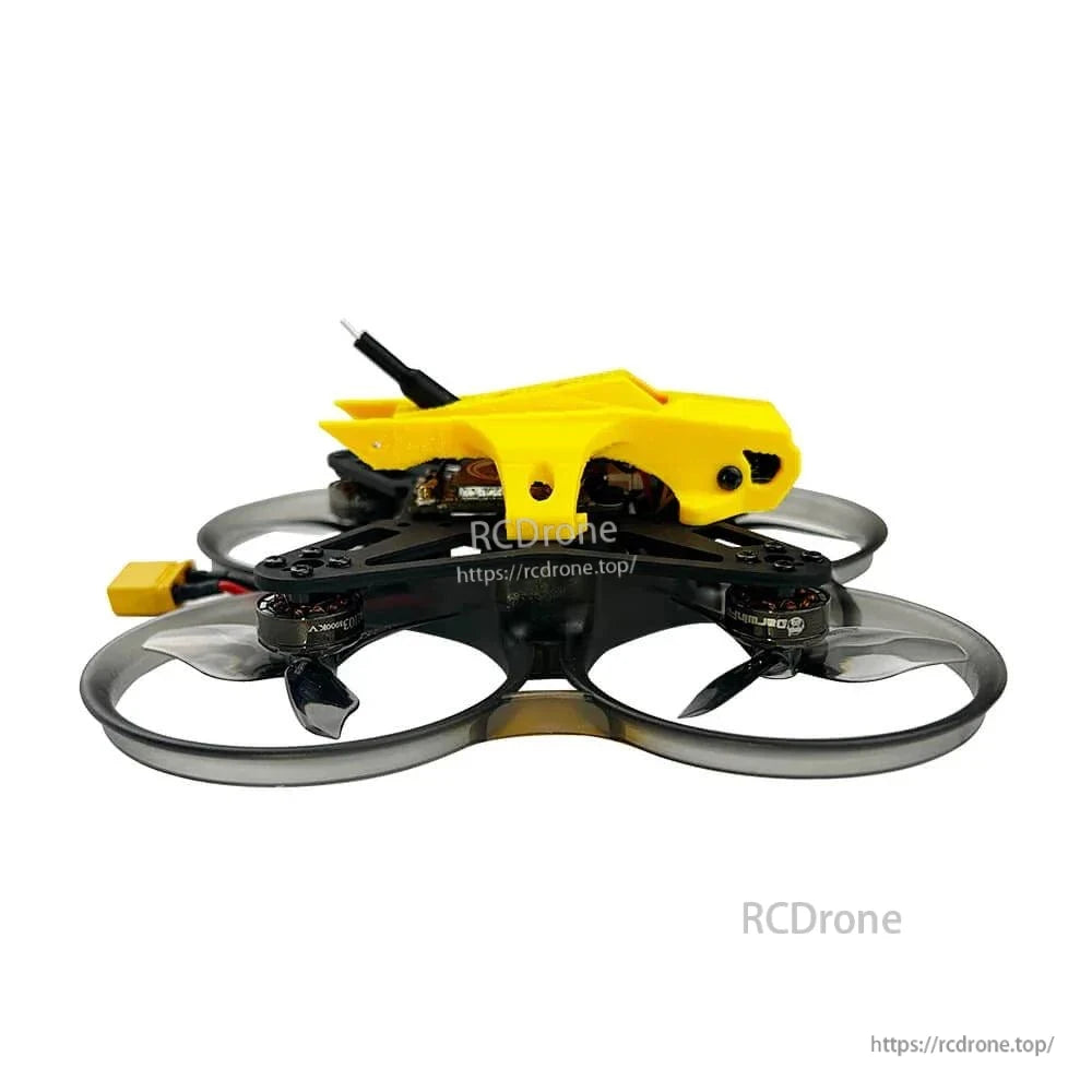 Side profile of ducted whoop drone showing low frame height, prop guards, and yellow canopy