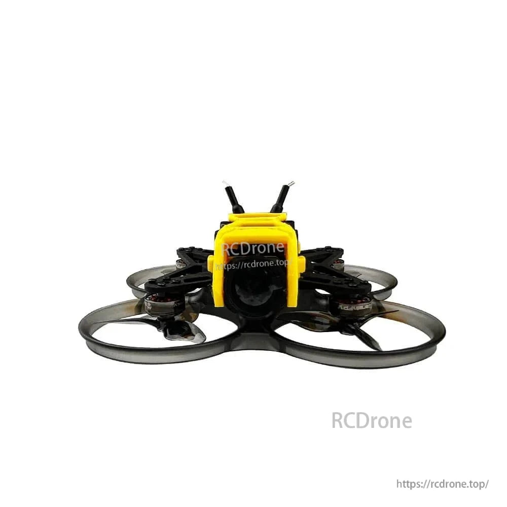 Front view of ducted whoop drone with camera lens centered between prop ducts and yellow bumper