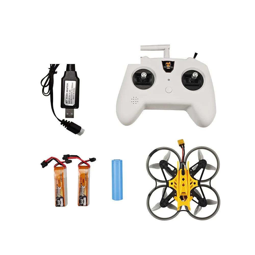 Kit contents layout: white controller, yellow cinewhoop quad, USB charger, two LiPo batteries and blue battery pack