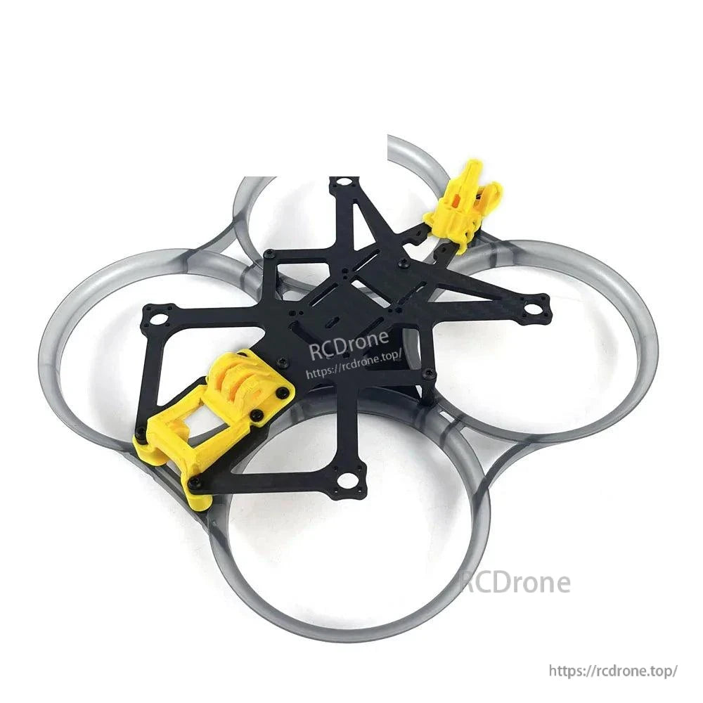 Angled view of ducted cinewhoop frame with carbon fiber plate stack and yellow TPU mounts