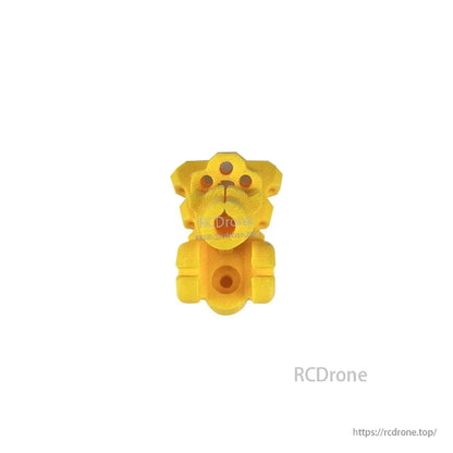 Yellow TPU mount block, front view showing center opening and multiple screw holes